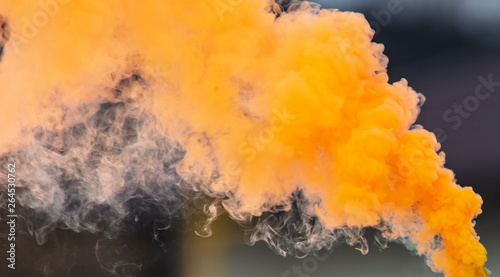 Orange smoke outdoors as background