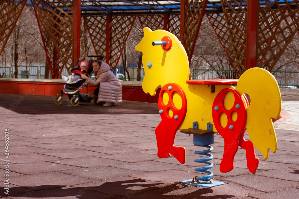 Yellow with red swing spring horse toy for kids on a children s