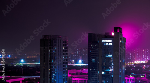 Photography Purple night skyline of a modern city