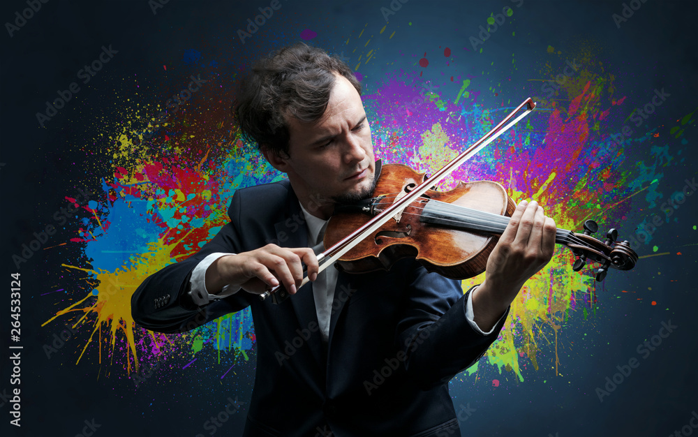 Young classical violinist musician with colorful splotch wallpaper
