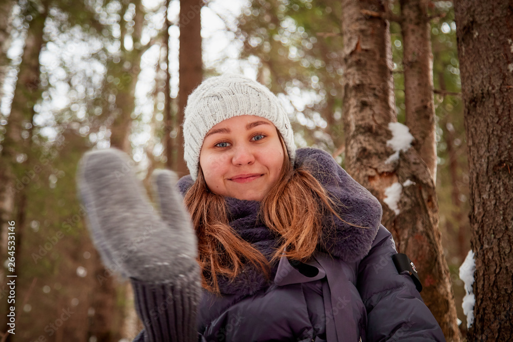 Portrait of a girl in a pine forest on a winter day Portrait of a girl in a pine forest on a winter day