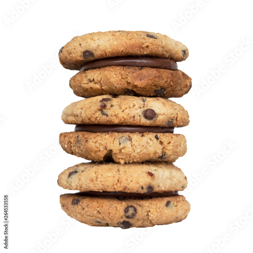 Stack of delicious italian sandwich cookies Baci di Dama (Lady's Kisses) made with hazelnut flour, chocolate chips and filled with gianduja spread isolated on white background. Piedmont speciality