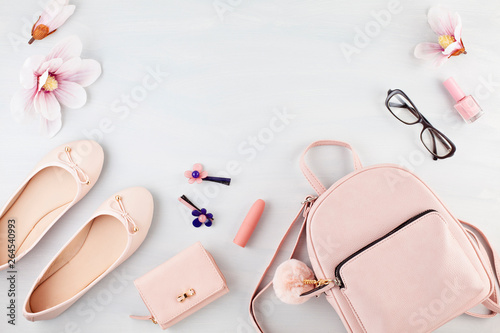 Flat lay with girls spring summer accessories in pink pastel tones. Casual urban summer style