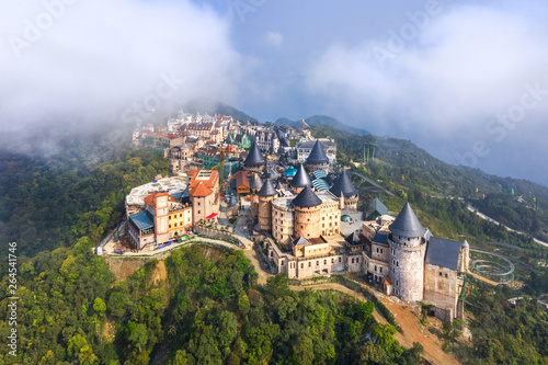 Aerial view of landscape is castles covered with fog at the top of Bana Hills...