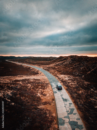 Car on a lonely road at the coast