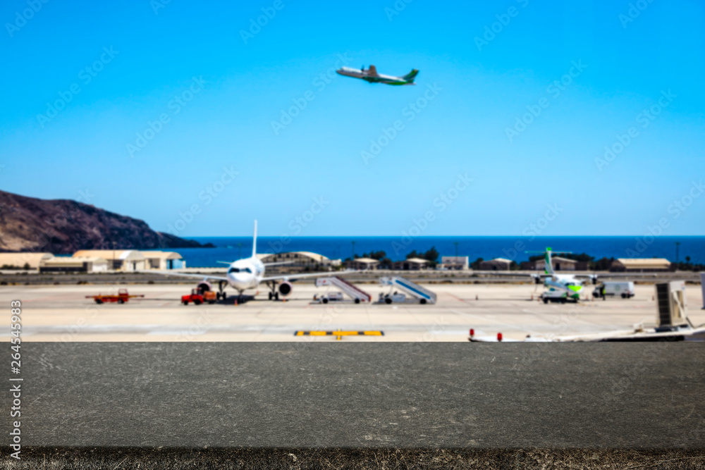 Desk of free space and airport background. Desk of free space and airport background.