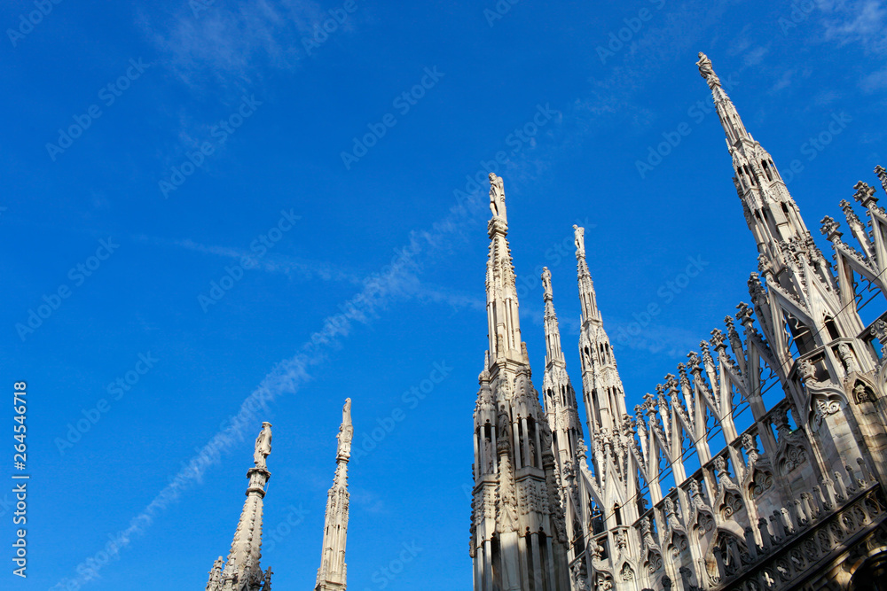 Sculptures Cathedral Duomo di Milano against the sky in Italy