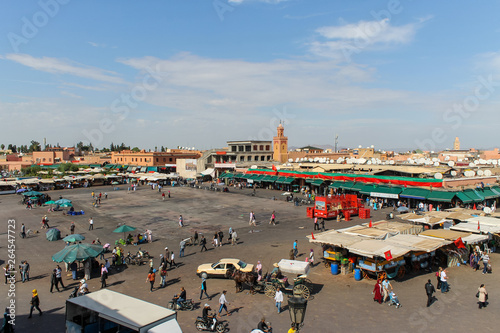 Jamaa el Fna market square during daytime, Marrakesh, Morocco, north Africa. Jemaa el-Fnaa, Djema el-Fna or Djemaa el-Fnaa is a famous square and market place in Marrakesh's medina quarter. photo