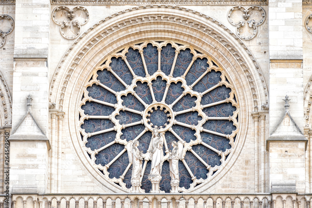 PARIS, NOTRE DAME: The western rose window, and architectural details of the catholic cathedral Notre-Dame de Paris. Built in French Gothic architecture, and it is among the largest and most famous