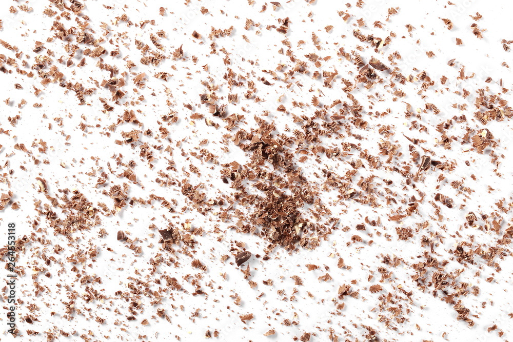 Pile chopped, milled chocolate with hazelnut isolated on white background, top view