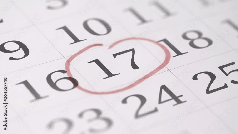 Marking the seventeenth 17 day of a month in the calendar with a red marker Marking the seventeenth 17 day of a month in the calendar with a red marker