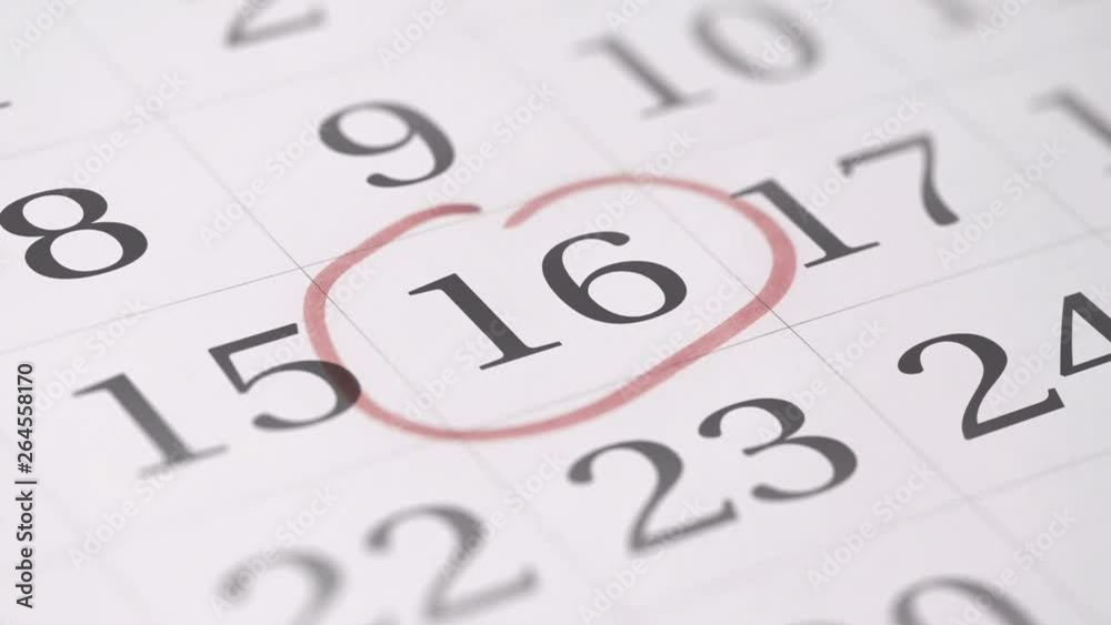 Marking the sixteenth 16 day of a month in the calendar with a red marker Marking the sixteenth 16 day of a month in the calendar with a red marker