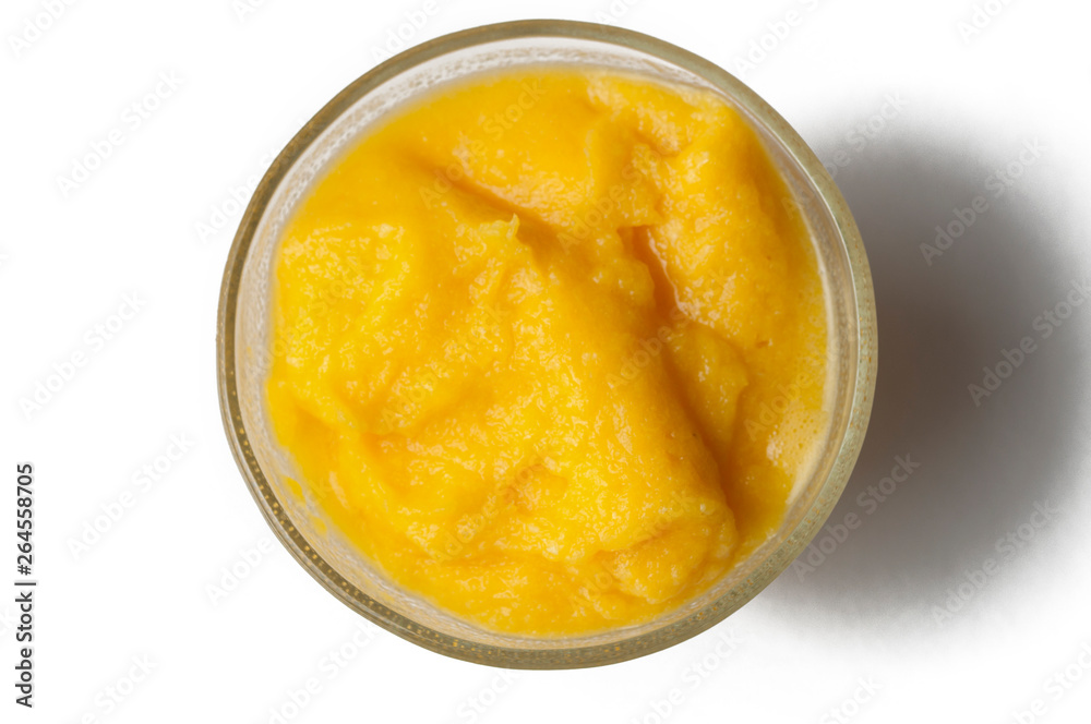 Grinded orange in bowl isolated on a white background.Fruit Grinded orange in bowl isolated on a white background.Fruit