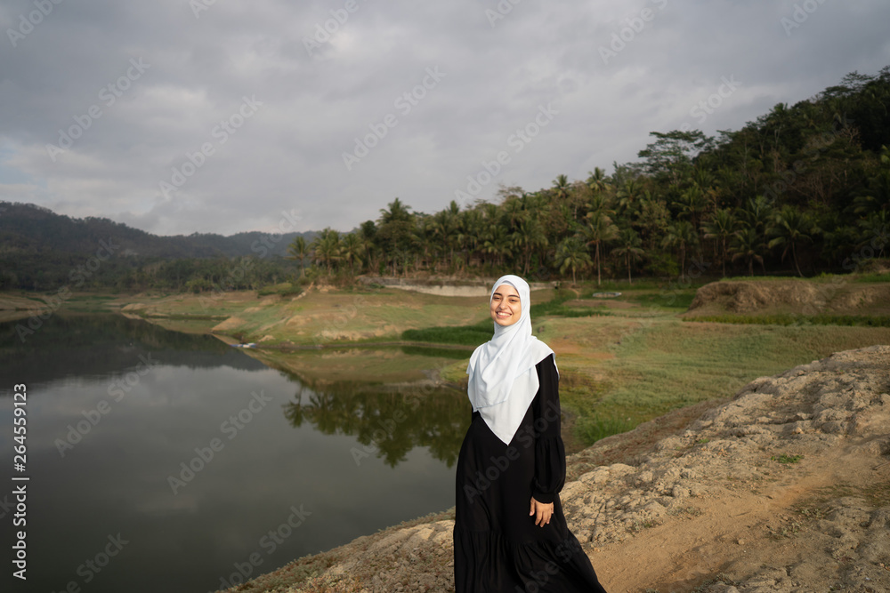 Fototapeta premium muslim arabic woman at beautiful outdoor enjoy carefree concept