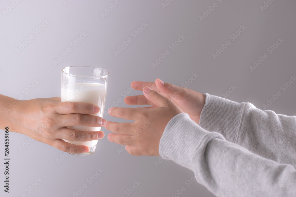Drink and health care concept. , Closeup woman hand giving glass of milk to child. Drink and health care concept. , Closeup woman hand giving glass of milk to child.