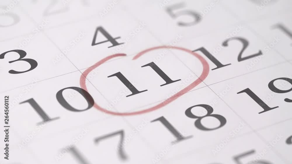 Marking the eleventh 11 day of a month in the calendar with a red marker Marking the eleventh 11 day of a month in the calendar with a red marker