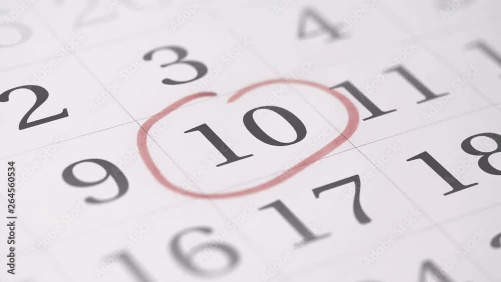 Marking the tenth 10 day of a month in the calendar with a red marker Marking the tenth 10 day of a month in the calendar with a red marker
