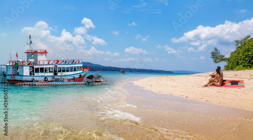 North Bay island sea beach Andaman with view of tourist speed boat and tourist enjoying a sun bask at the beach © Roop Dey