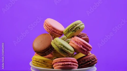 Wallpaper Mural A colorful macaroons are rotating on violet background Torontodigital.ca