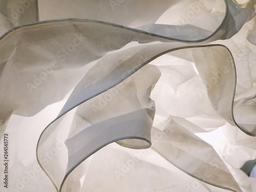 abstract modern white paper or fabric lamps hanging under a ceiling