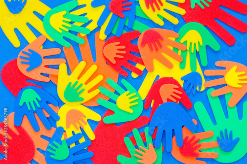 Abstract background of funky foam hands cutouts of different sizes in red  orange  yellow  green and blue