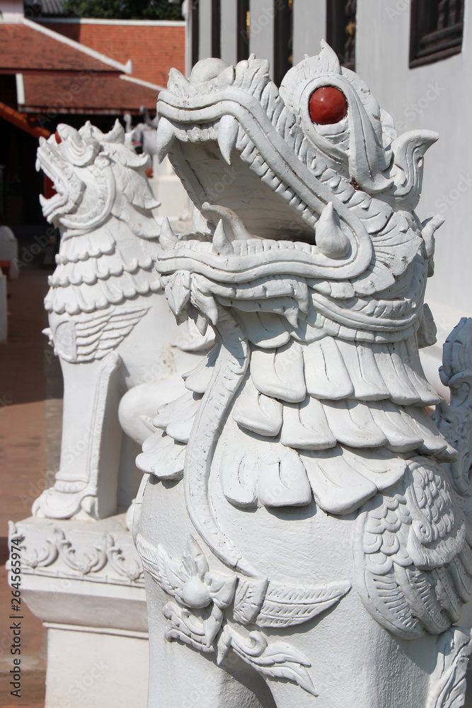 statue of a lion in a buddhist temple (Wat Duang Di) in chiang mai (thailand) statue of a lion in a buddhist temple (Wat Duang Di) in chiang mai (thailand)