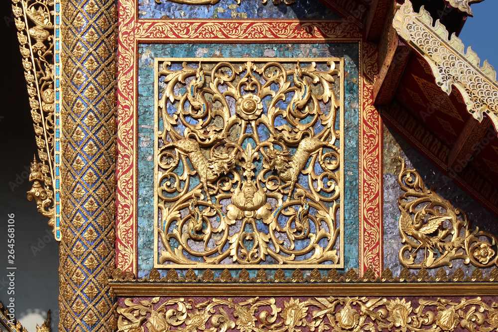 facade (detail) of a pavilion in a buddhist temple (Wat Phra Sing) in chiang mai (thailand)