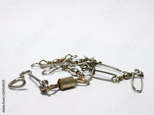 Closeup and macro shot of fishing accessories, fishing hock and fishing swivel with white background. 