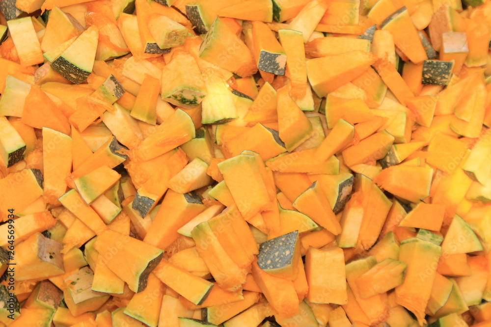 Beautiful ripe Fresh raw peeled pumpkin slices. Food background. pumpkin are good for health, healthy ripe pumpkin for preparing meal.