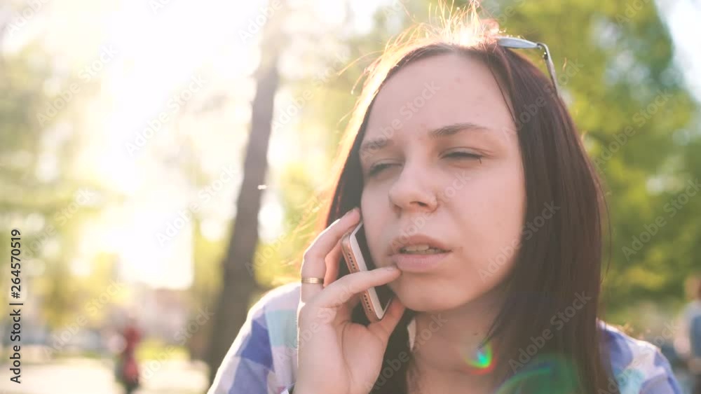 young womanadult, alone, attractive, backpack, brunette, casual, charming, clothes, cool, copyspace, cute, expression, face, Facial expression, feeling, female, fence, joy, lady, l using smartphone young womanadult, alone, attractive, backpack, brunette, casual, charming, clothes, cool, copyspace, cute, expression, face, Facial expression, feeling, female, fence, joy, lady, l using smartphone