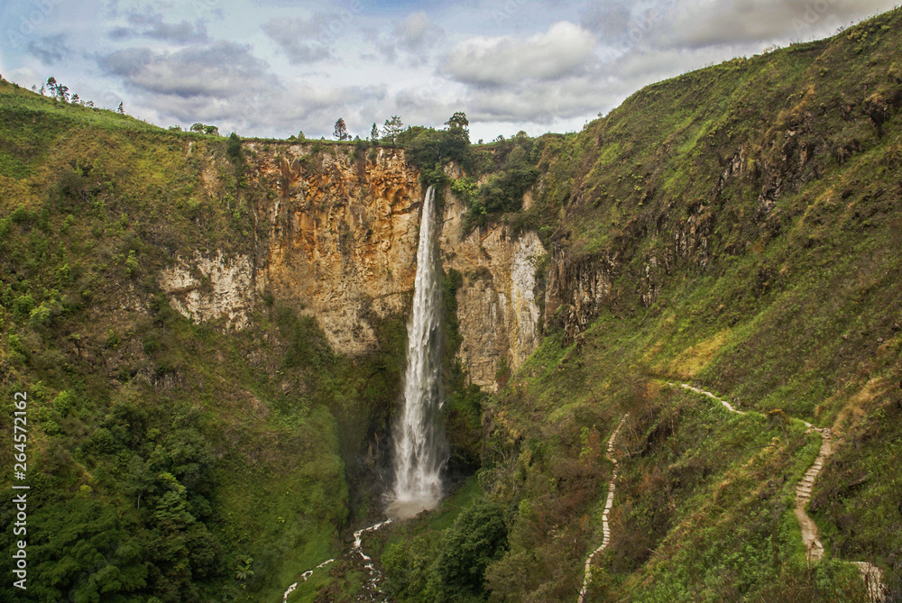 Sipiso piso waterfall is a plunge waterfall in the Batak highlands of Sumatra. It is formed by a small underground river of the Karo plateau.