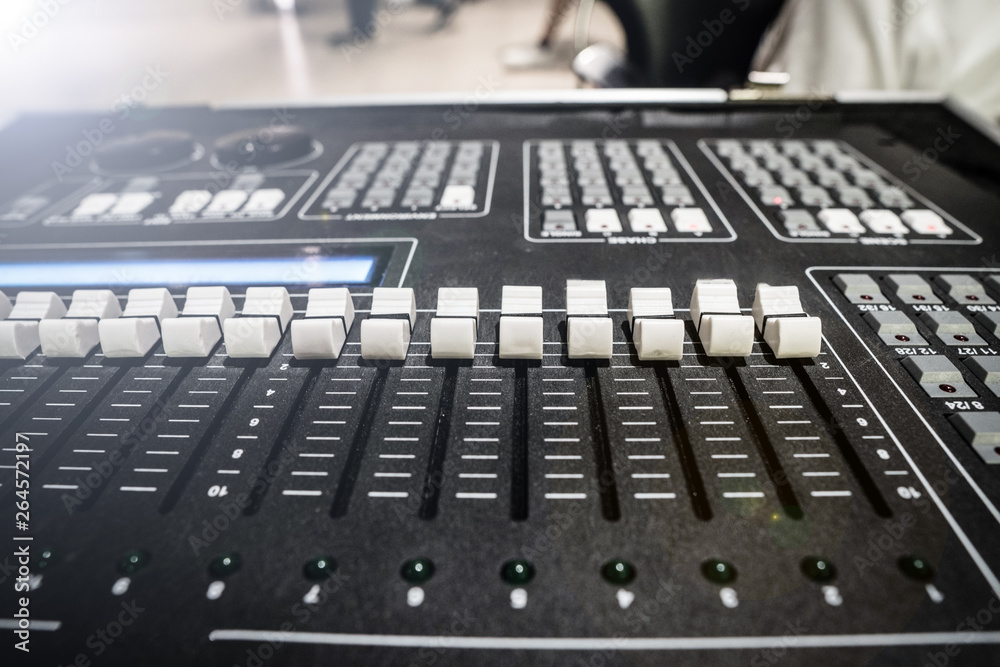 Sound Mixer Board with button to adjust detail of volume high low bar for MC DJ on stage and profession to speak in presentation and business purpose, close up soundboard equipment, blur some detail
