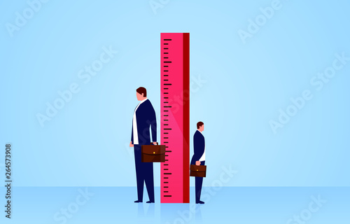 Measuring, two businessmen stand sideways on both sides of the ruler
