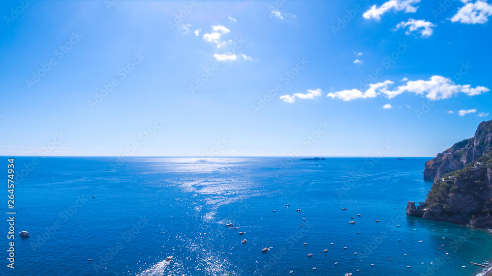 Fototapeta premium view of the horizon, the sea, the ocean. rocks and mountains, boats and ships, recreation and holidays in Europe, Italy. place for text. fishing. transport, transportation of tourists, tours and trips