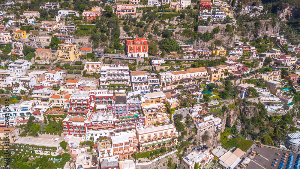 aerial view of the touristic city, the mountains road, cars and baus, building the beach, hotels and restaurants, buildings, business tours, sea holidays, luxury apartments Positano, Amalfi, Italy