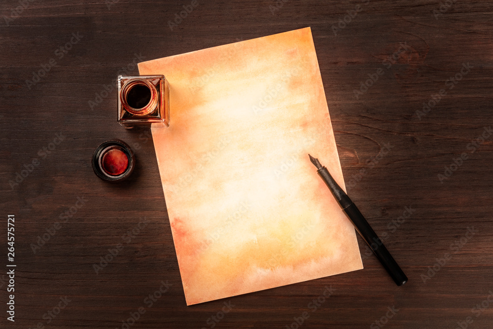 Φωτογραφία A vintage background with a nib pen on a piece of old paper, with an ink well, s