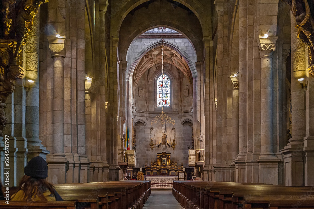 Fototapeta premium Braga, Portugal - December 28, 2017: Se de Braga Cathedral interior. Nave, main chapel and altar. Oldest Cathedral in Portugal. 11th century Romanesque with Gothic and Baroque adding