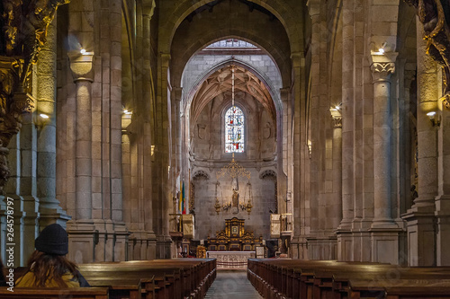 Braga, Portugal - December 28, 2017: Se de Braga Cathedral interior. Nave, main chapel and altar. Oldest Cathedral in Portugal. 11th century Romanesque with Gothic and Baroque adding