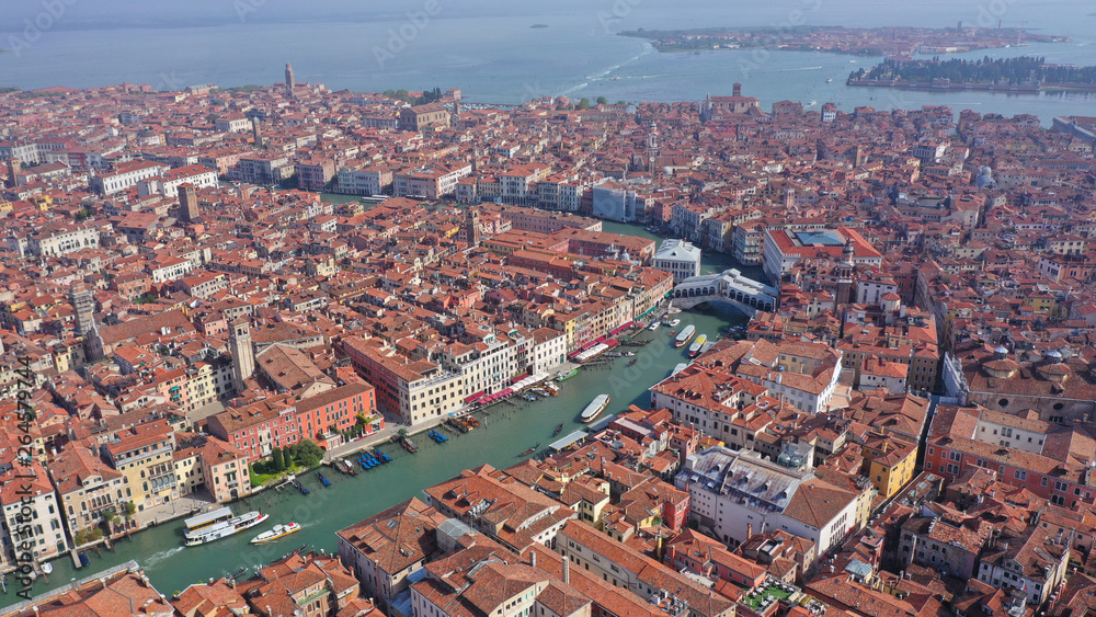 Aerial drone panoramic photo of iconic and unique Grand Canal crossing city of Venice as seen from high altitude, Italy
