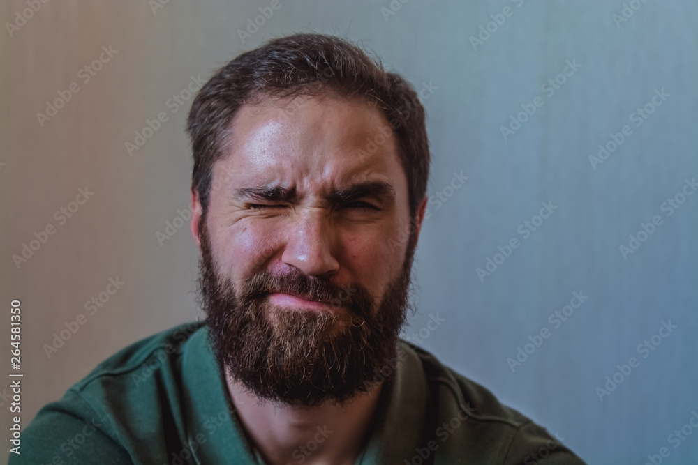 Obraz premium Various emotions on a face at the young bearded European man. Different mood.