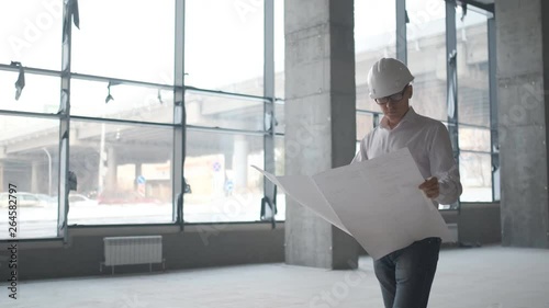 Architect or engineer working, browsing building project indoor of construction site with blueprint plan. businessman worker, man male construction engineers or architects working people