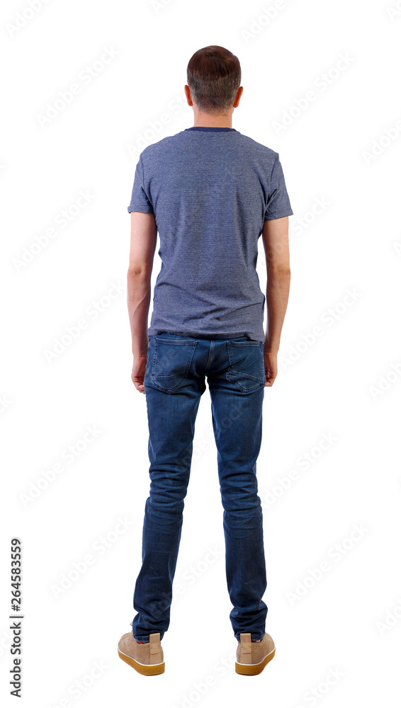 Back view of man in jeans. Standing young guy. Back view of man in jeans. Standing young guy.