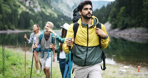 Group of people hikers walking in mountains