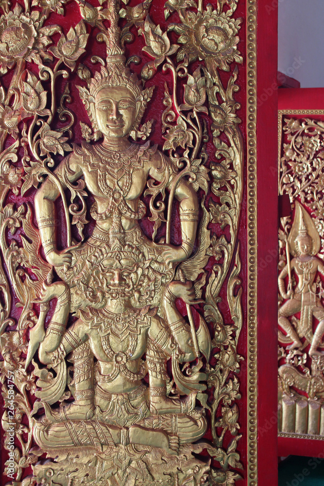 bas-relief on a wall in a buddhist temple (Wat Pan Ping) in chiang mai (thailand) bas-relief on a wall in a buddhist temple (Wat Pan Ping) in chiang mai (thailand)