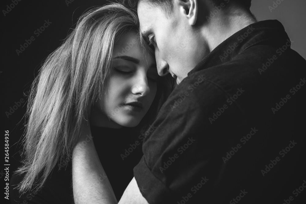 Couple in love in studio. Black and white Couple in love in studio. Black and white