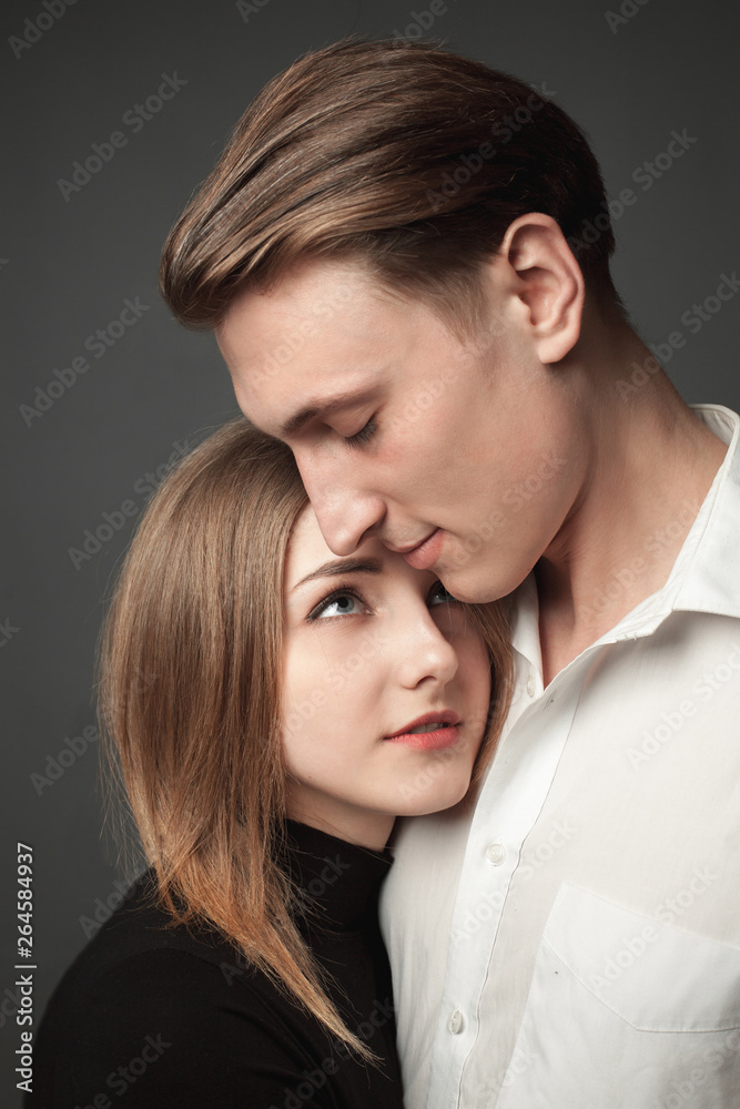 Portrait of young couple in love in studio