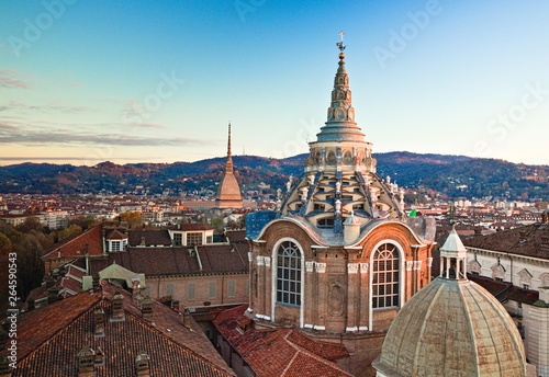 View from the bell tower of the Cathedral, towards the Dome of the Chapel that houses the Holy Shroud, and the Mole Antonelliana, background of hills, seen at sunset, Turin, Piedmont, Italy © Marco