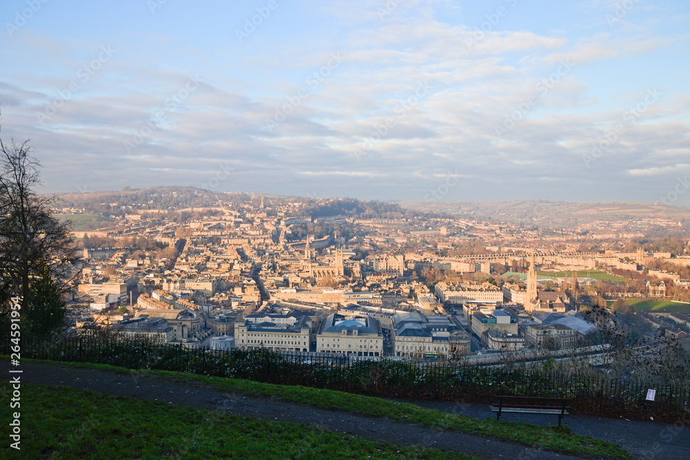 Fototapeta premium Aerial view on Bath old town at sunset from Alexandra Park, cloudy blue sky. Somerset, England