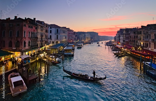 Venice, Italy - December 29, 2018: Sunset view from Ponte Di Rialto on the Grand Canal, with boats and gondolas © Marco