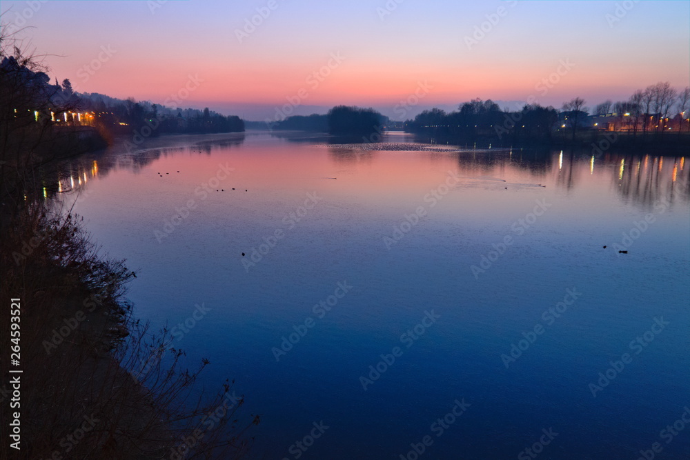 Romantic purple sunset on the Po river in San Mauro Torinese, near Turin, Piedmont, Italy